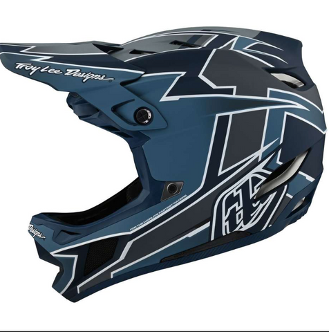 Blue motocross helmet with white designs on a white background