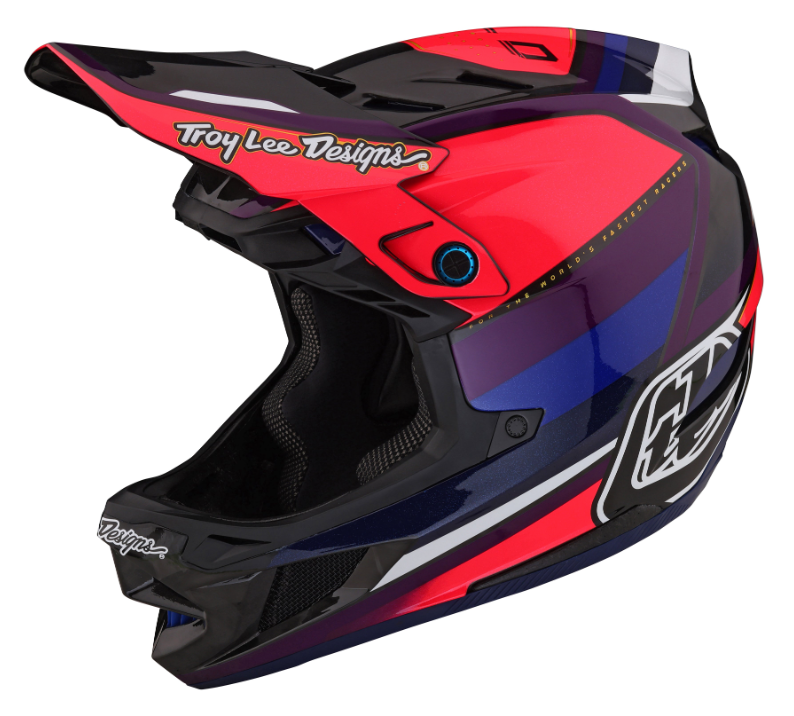 Red, black, and blue Troy Lee Designs helmet on a white background