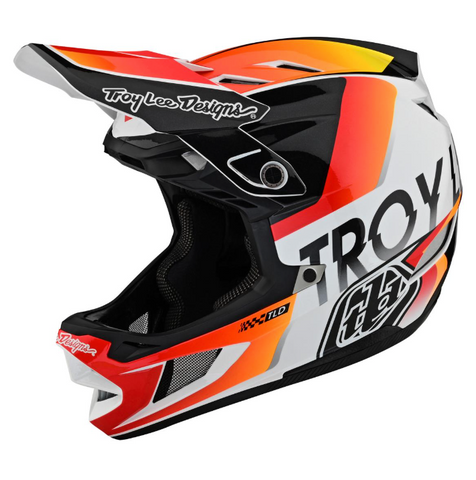 Troy Lee Designs motorcycle helmet with red, black, and white design on a white background