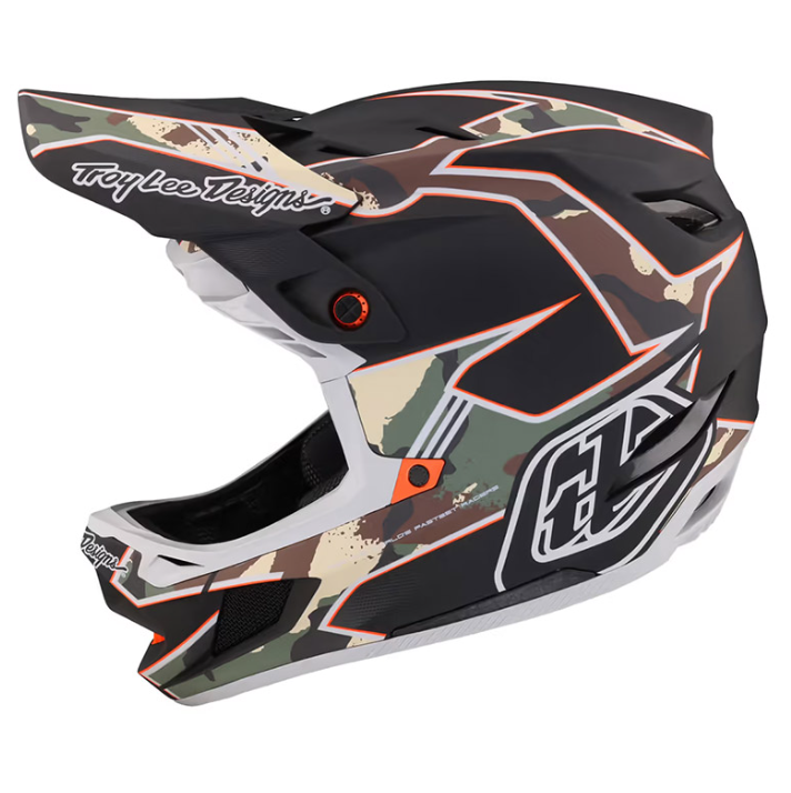 Camouflage motocross helmet with Troy Lee Designs branding on a white background