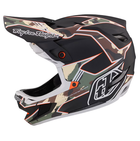Camouflage motocross helmet with Troy Lee Designs branding on a white background