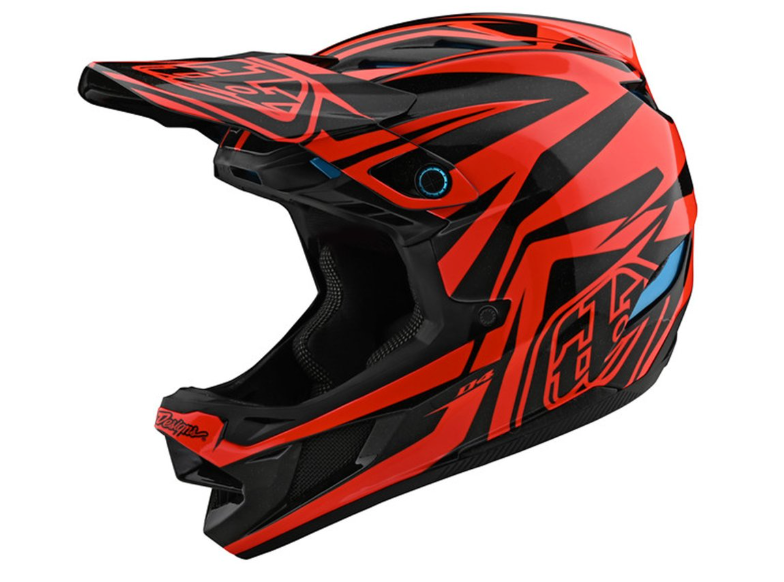 Red and black motocross helmet on a white background