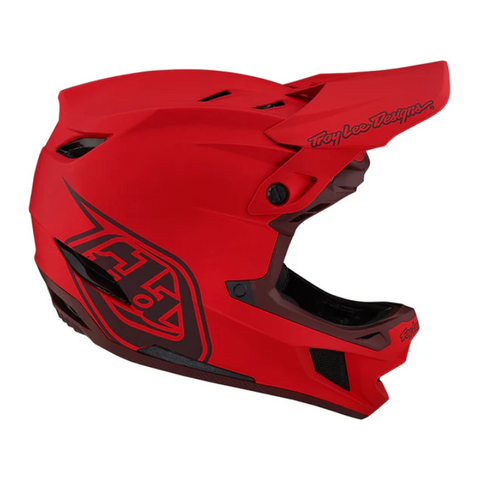 Red motocross helmet with visible branding on a white background