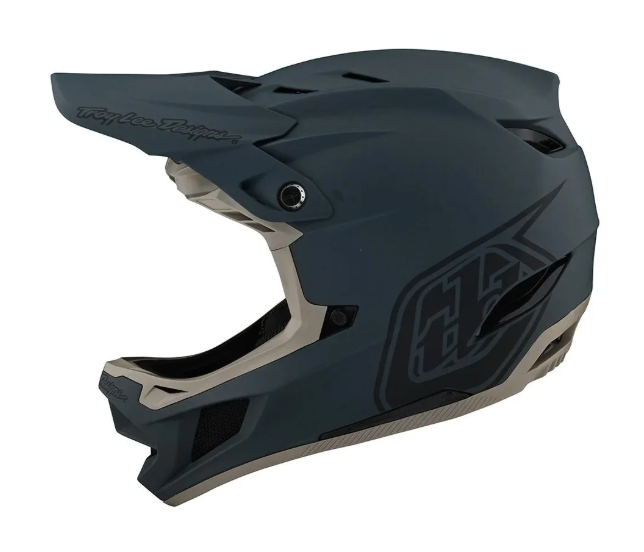 Dark gray motocross helmet with brand logo on a white background