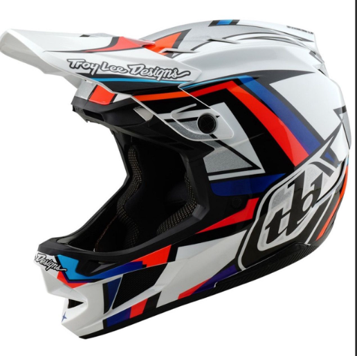 Motocross helmet with colorful design and Troy Lee Designs branding on a white background