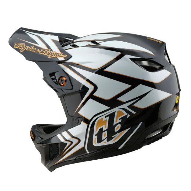 Motorcycle helmet with white, black, and gold design on a white background
