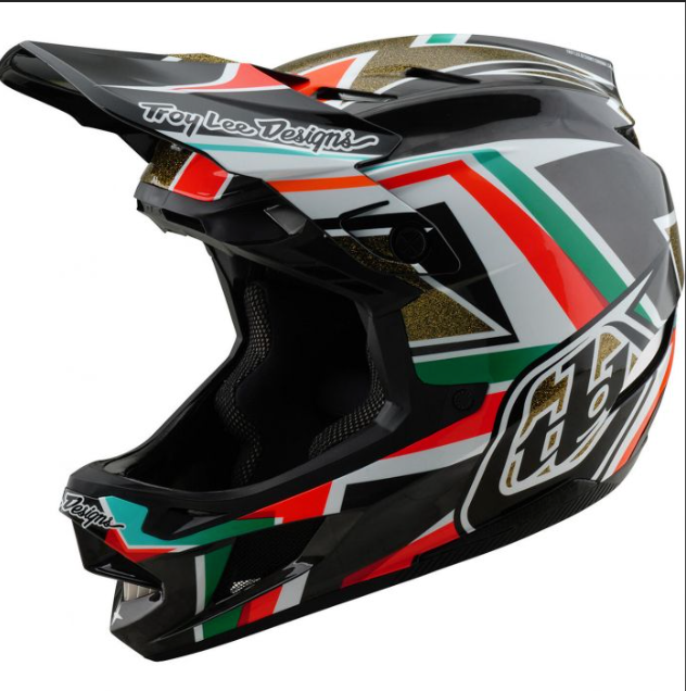 Colorful motorcycle helmet with Troy Lee Designs branding on a white background