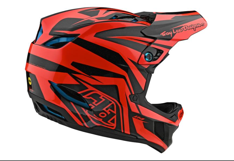 Red and black motorcycle helmet with Troy Lee Designs branding on a white background