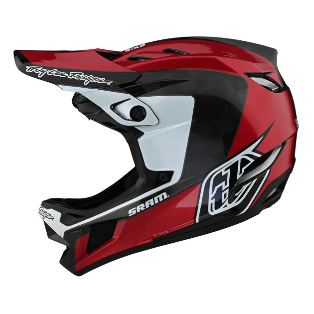 Red and black motocross helmet with visible branding on a white background