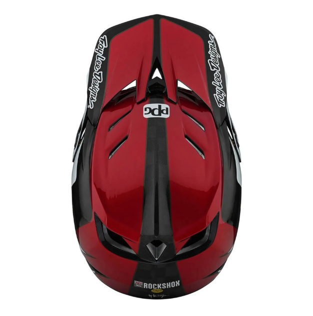 Red and black helmet with visible branding on a white background