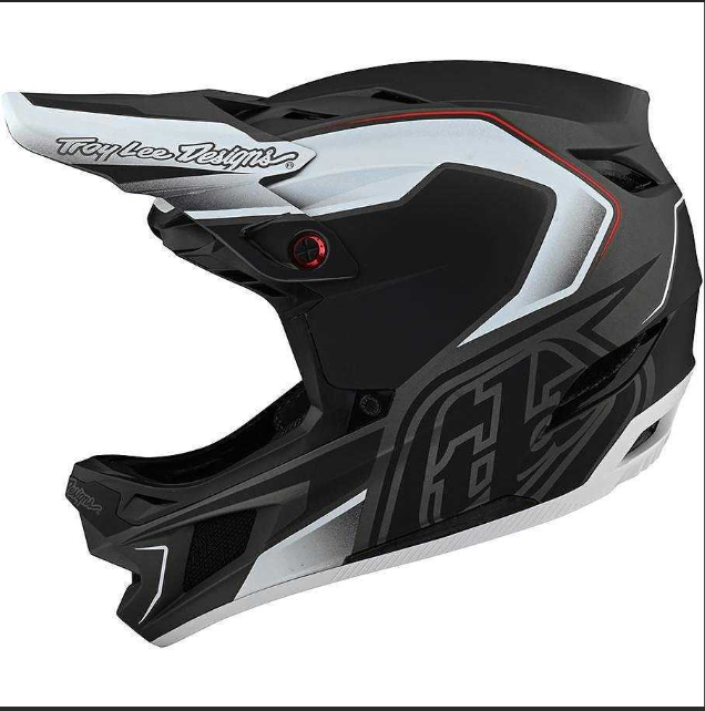 Black and white motocross helmet with Troy Lee Designs branding on a white background
