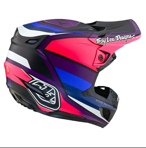 Colorful motorcycle helmet with Troy Lee Designs branding on a white background