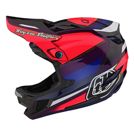 Red, black, and blue motocross helmet with visible branding on a white background