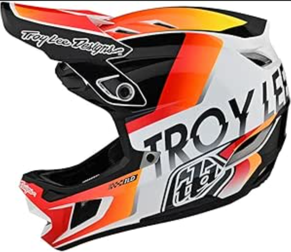 Troy Lee Designs motorcycle helmet with orange, black, and white design on a white background