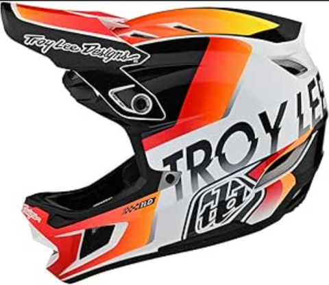 Troy Lee Designs motorcycle helmet with orange, black, and white design on a white background