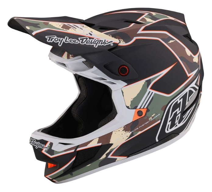 Camouflage motocross helmet with Troy Lee Designs branding on a white background