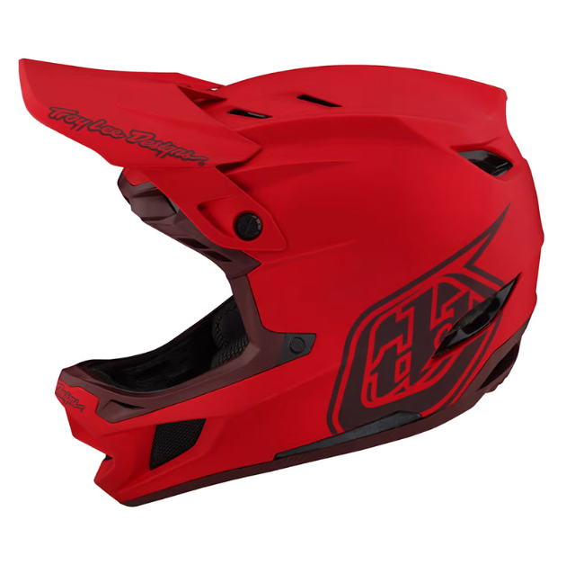 Red motocross helmet with black logo on a white background