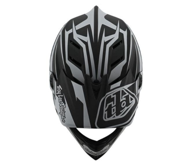 Black and gray motocross helmet with 'Troy Lee Designs' logo on a white background